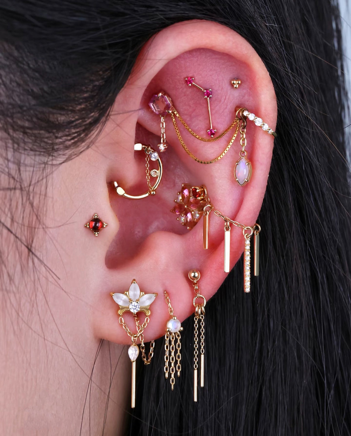 Curated gold ear jewelry and piercing by Urban Ink