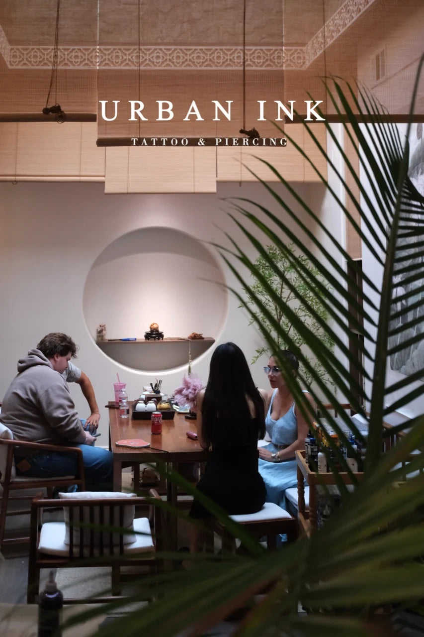 Guests in conversation inside the Urban Ink studio