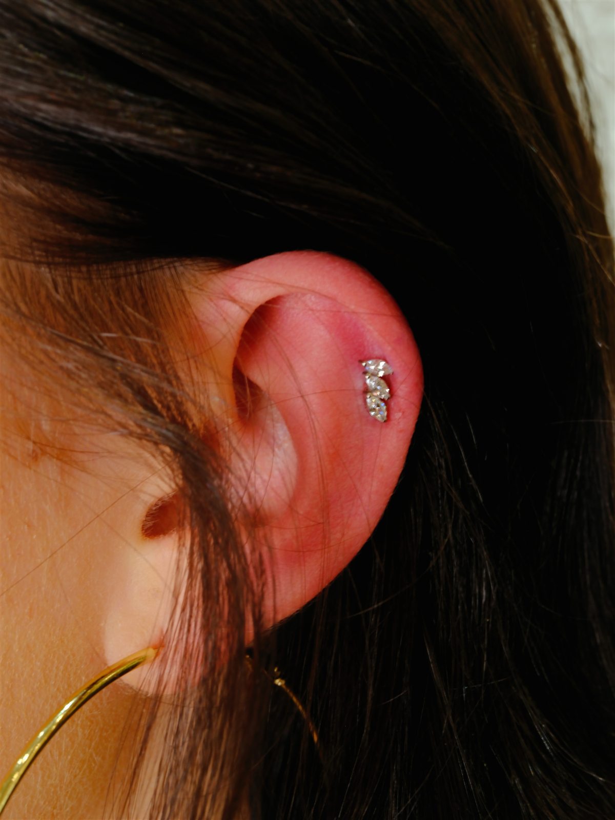 Crystal helix piercing completed at Urban Ink