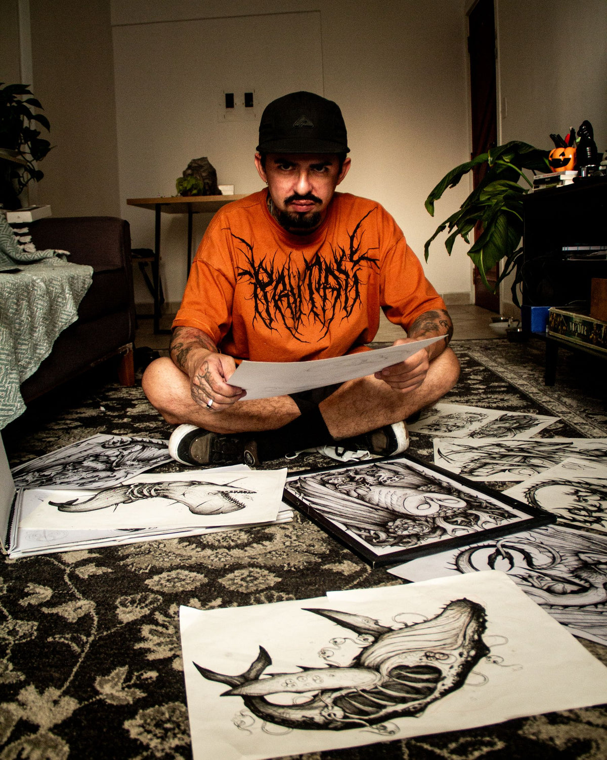 Tattoo artist reviewing custom design sketches for a personal tattoo story