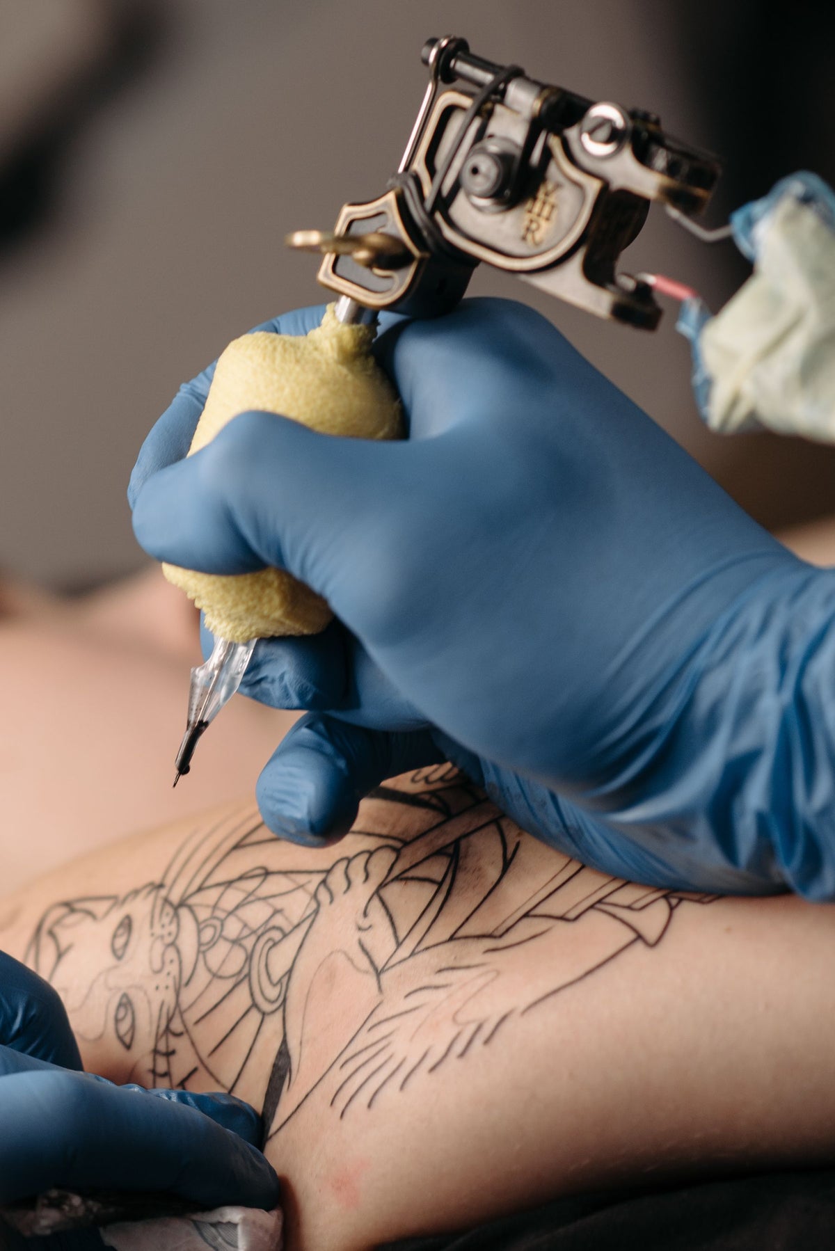 Close-up of a tattoo machine for a Los Angeles tattoo payment plan guide