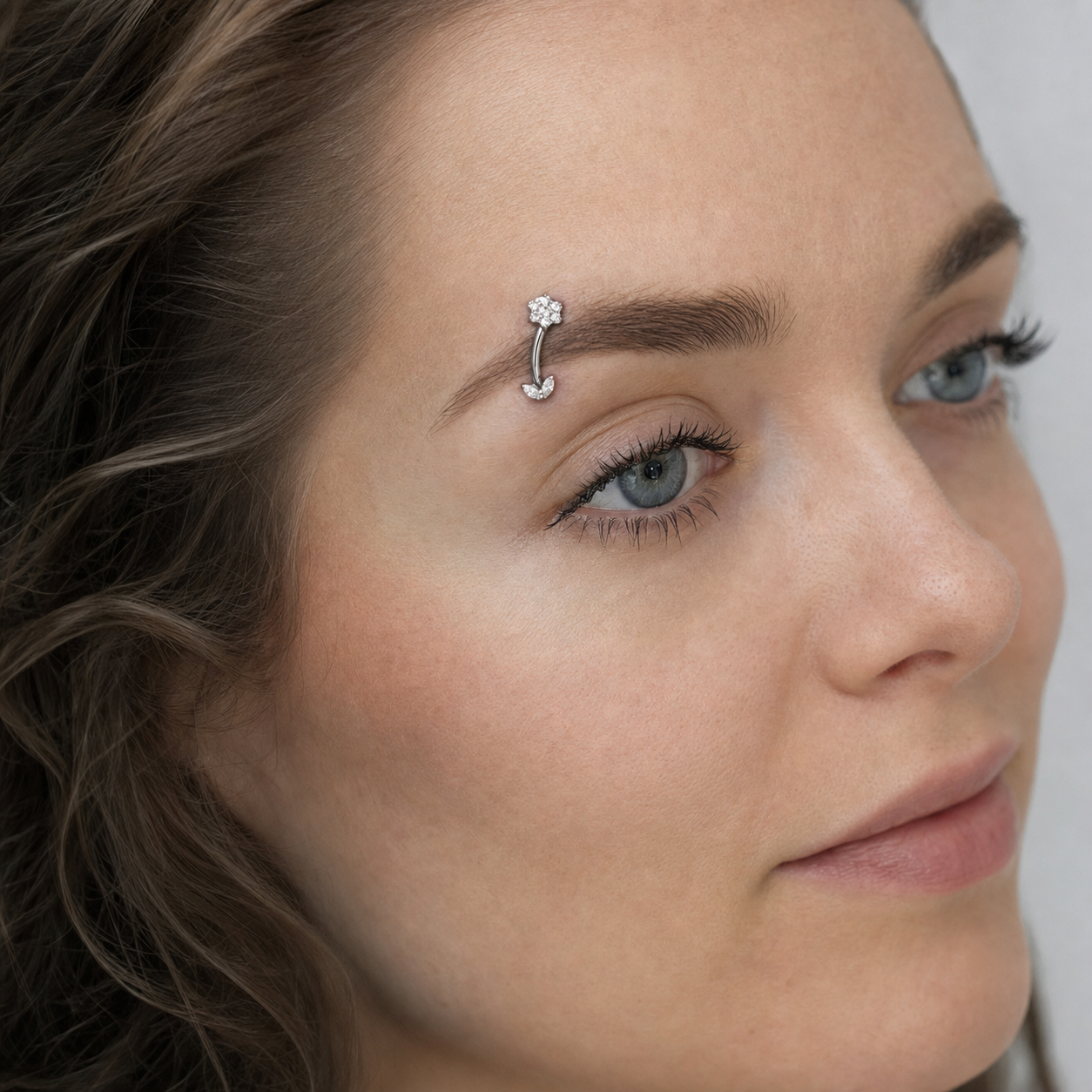 Clear CZ ASTM F136 Titanium Eyebrow Ring - Silver, Threadless, 16G, 1.2 x 8 mm — wearing view one (P-EB-0009-S01)