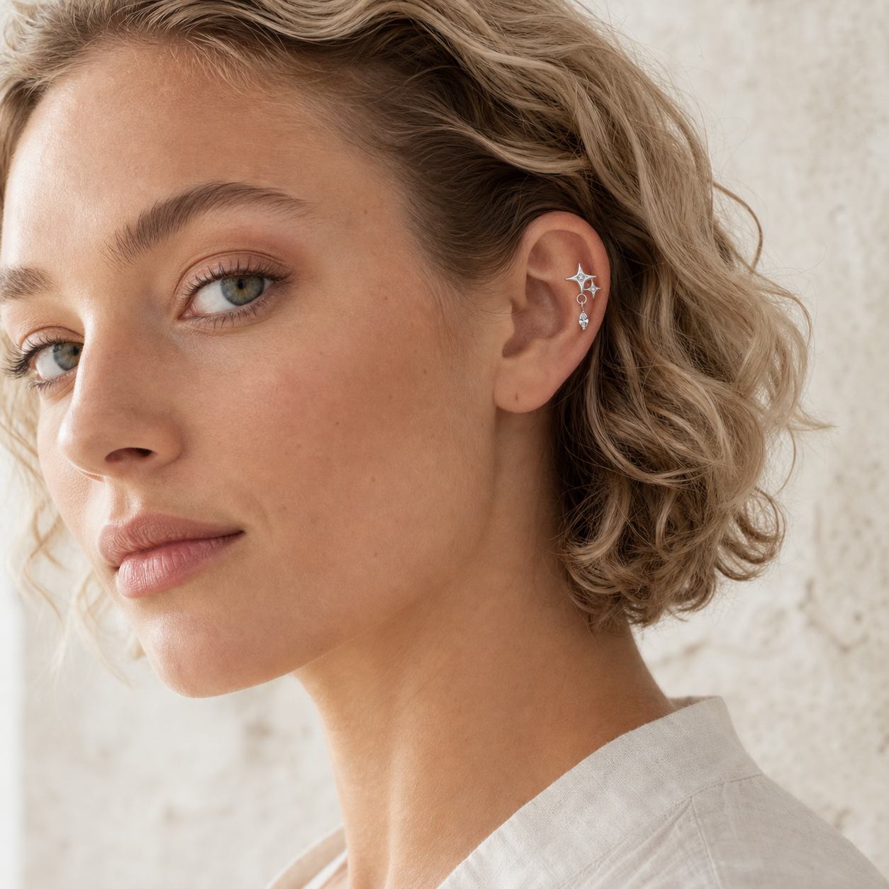 Clear CZ ASTM F136 Titanium Flat Back - Silver, Threadless, 16G, 1.2 x 6+4 mm — wearing view one (P-FB-0093-S01)