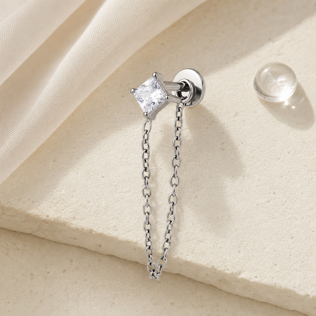 Clear CZ ASTM F136 Titanium Flat Back - Silver, Threadless, 18G, 1.0 x 6+4 mm — styled flat lay (P-FB-0101-S01)