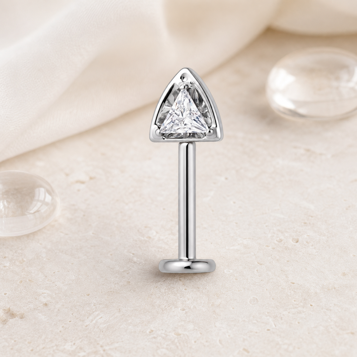 Clear CZ ASTM F136 Titanium Flat Back - Silver, Threadless, 16G, 1.2 x 8+4 mm — styled flat lay (P-FB-0105-S01)