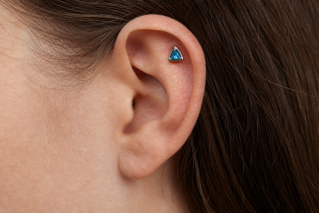 Blue CZ ASTM F136 Titanium Flat Back - Silver, Threadless, 16G, 1.2 x 8+4 mm — wearing view one (P-FB-0108-S01)