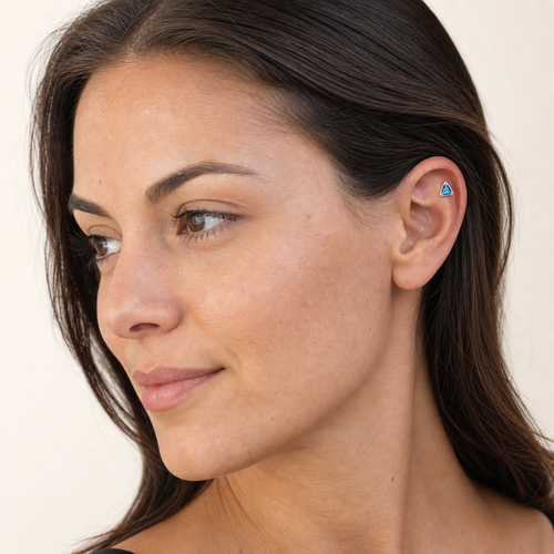 Blue CZ ASTM F136 Titanium Flat Back - Silver, Threadless, 16G, 1.2 x 8+4 mm — wearing view one (P-FB-0108-S01)
