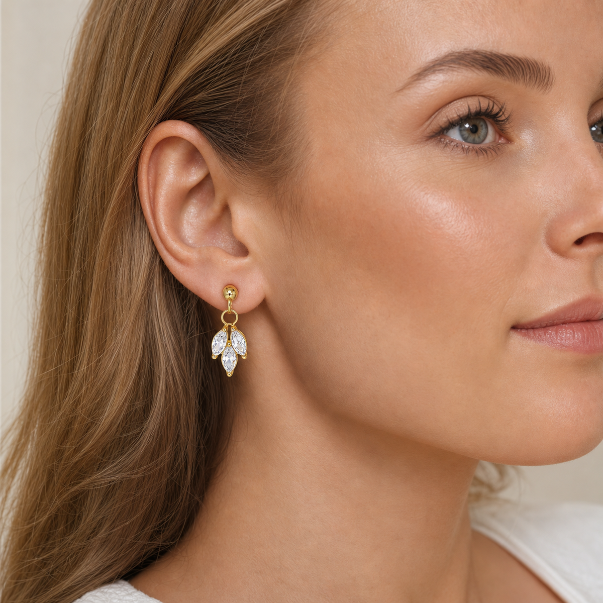 Clear CZ ASTM F136 Titanium Flat Back - Gold, Internally Threaded, 16G, 1.2 x 6 mm — wearing view on light skin (P-FB-0150-G01)