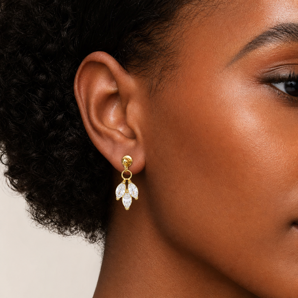 Clear CZ ASTM F136 Titanium Flat Back - Gold, Internally Threaded, 16G, 1.2 x 6 mm — wearing view on deep skin (P-FB-0150-G01)