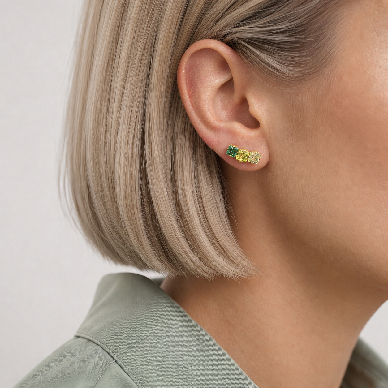Green CZ ASTM F136 Titanium Flat Back - Gold, Internally Threaded, 16G, 1.2 x 6+4 mm — wearing view one (P-FB-0176-G01)