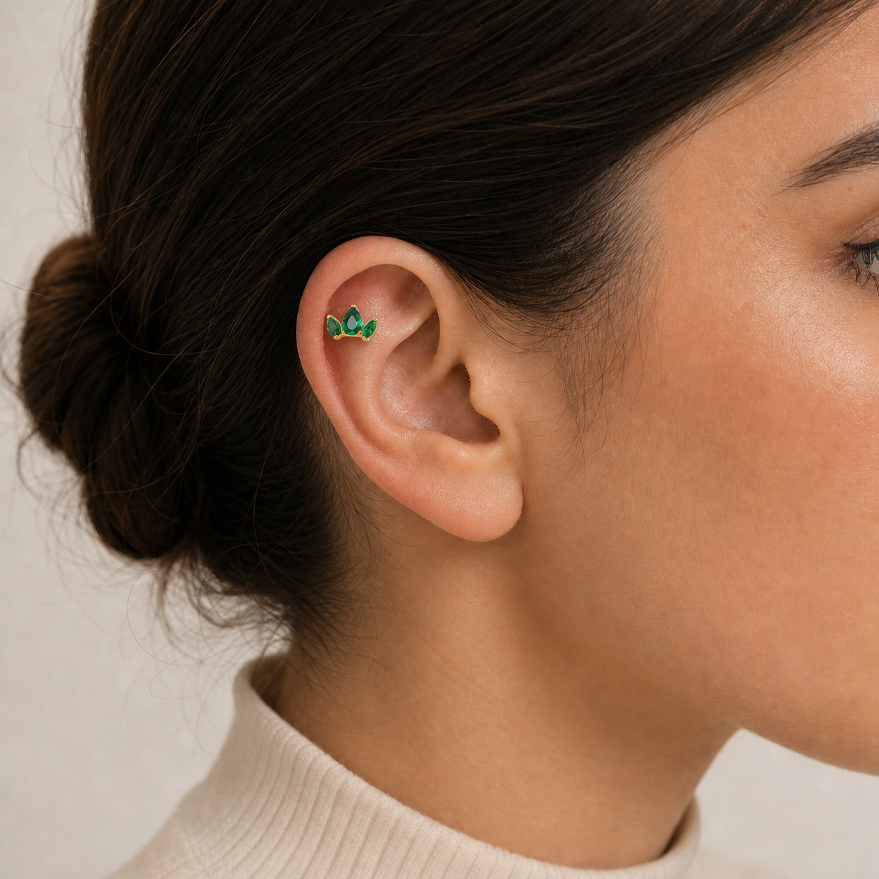Green CZ ASTM F136 Titanium Flat Back - Gold, Threadless, 16G, 1.2 x 6+4 mm — wearing view one (P-FB-0178-G01)