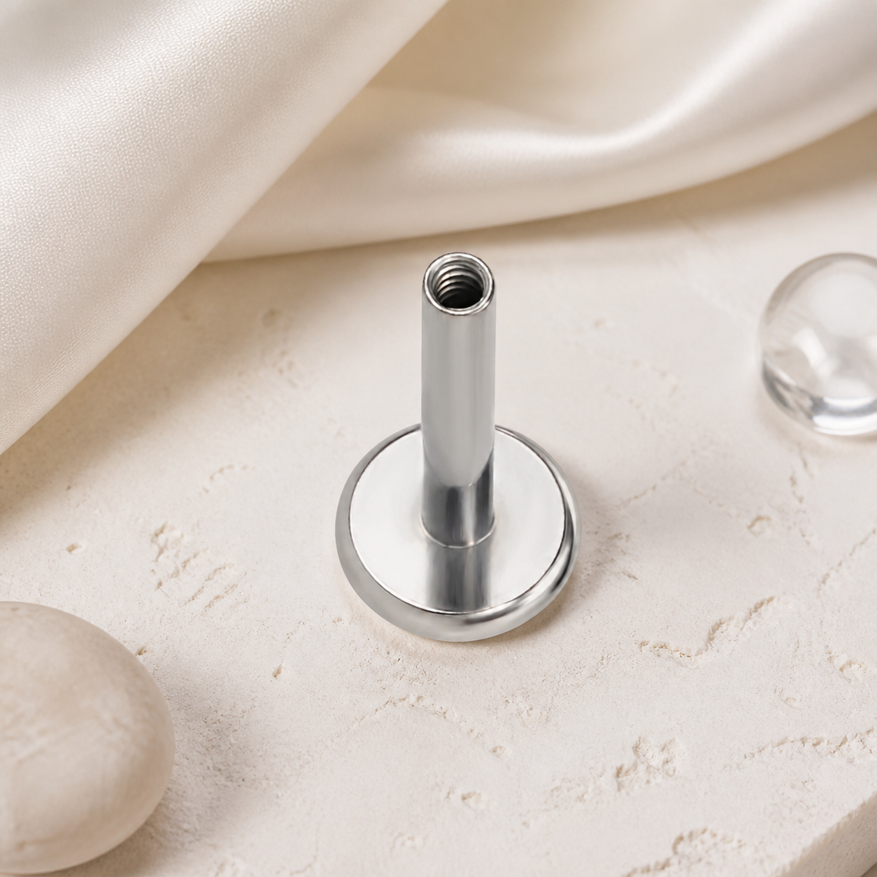 ASTM F136 Titanium Piercing Part - Silver, Internally Threaded, 16G, 1.2 x 7+4 mm — styled flat lay (P-PT-0020-S01)