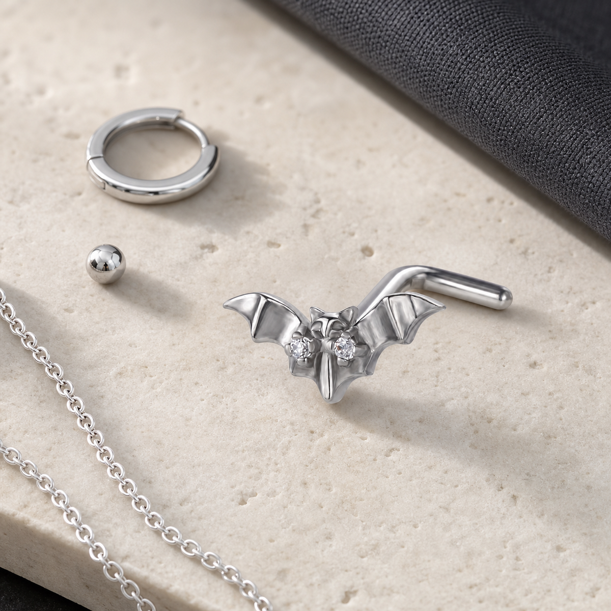 [TOPOSH-ROLE-ORDER-CLEANUP-20260717-BATCH09:TP-NS-L-SIL-20G7-PLN-001-NS012:06] Bat Titanium L-Bend Nose Stud – Silver | 06_accessory_flatlay
