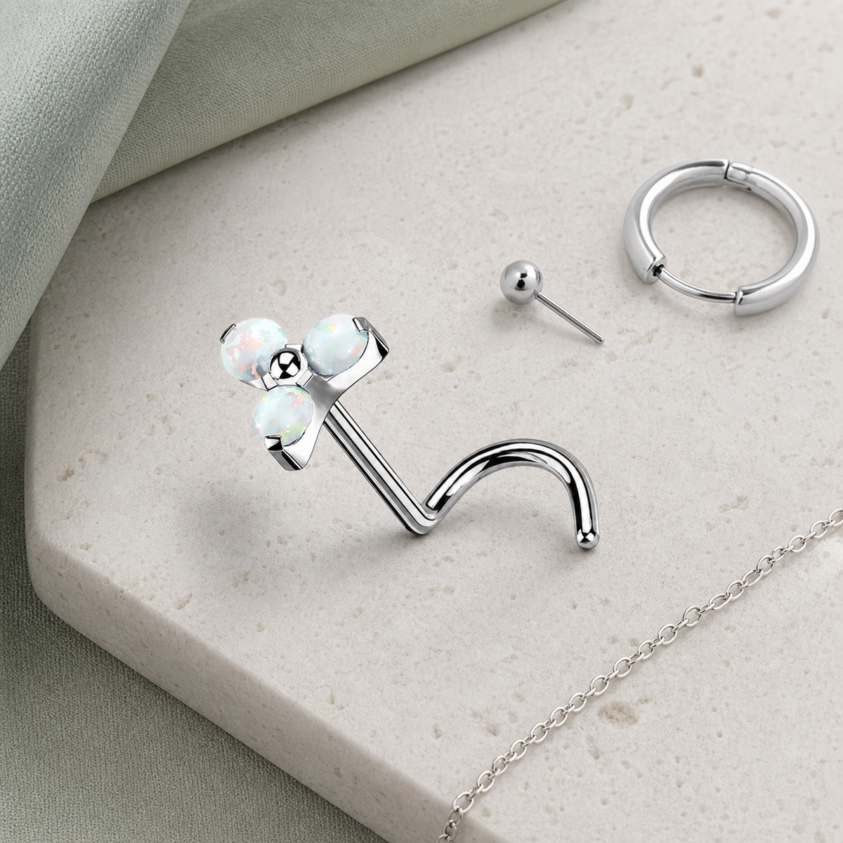 [TOPOSH-ROLE-ORDER-CLEANUP-20260717-BATCH12:TP-NS-SIL-0.8-WOP-053:06] White Opal Titanium Nose Jewelry – Silver | 06_accessory_flatlay