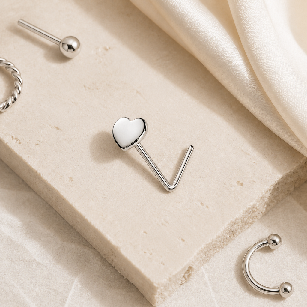[TOPOSH-ROLE-ORDER-CLEANUP-20260717-BATCH12:TP-NS-WG-20G6-PLN-025:06] Heart Titanium Nose Hoop – White Gold | 06_accessory_flatlay