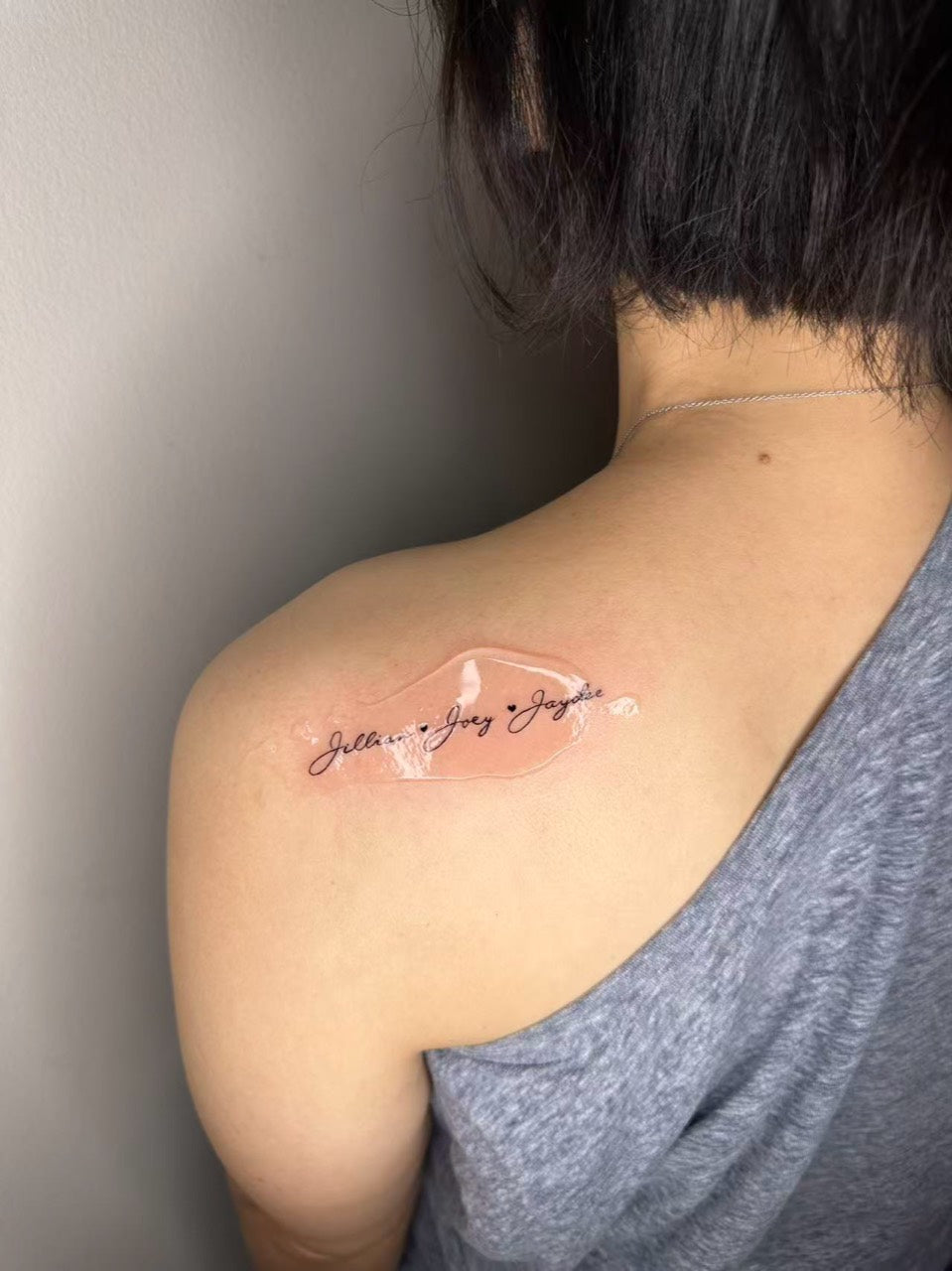 Fine-line family script tattoo by Urban Ink artist Owen