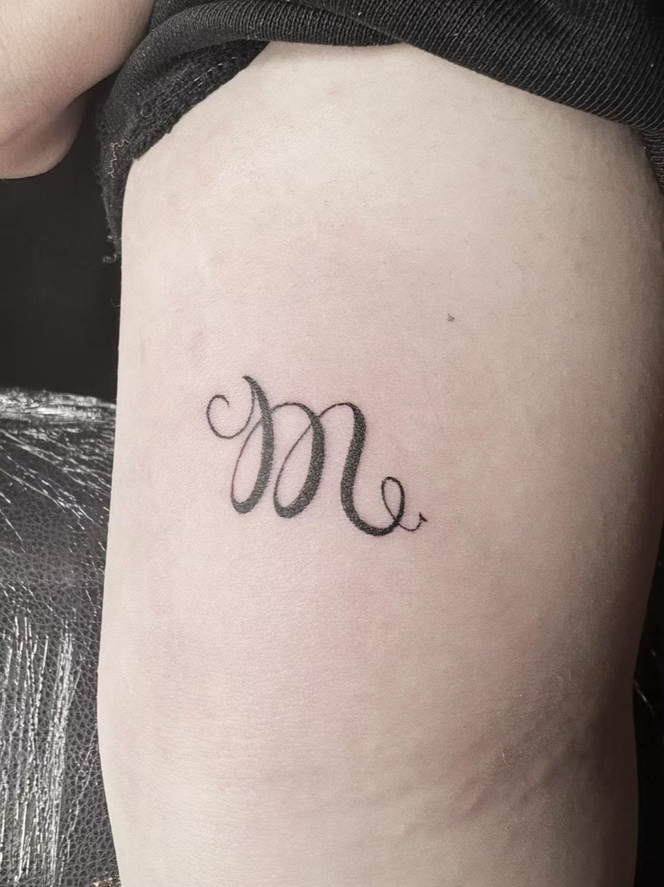 Small script monogram tattoo by Urban Ink artist Owen