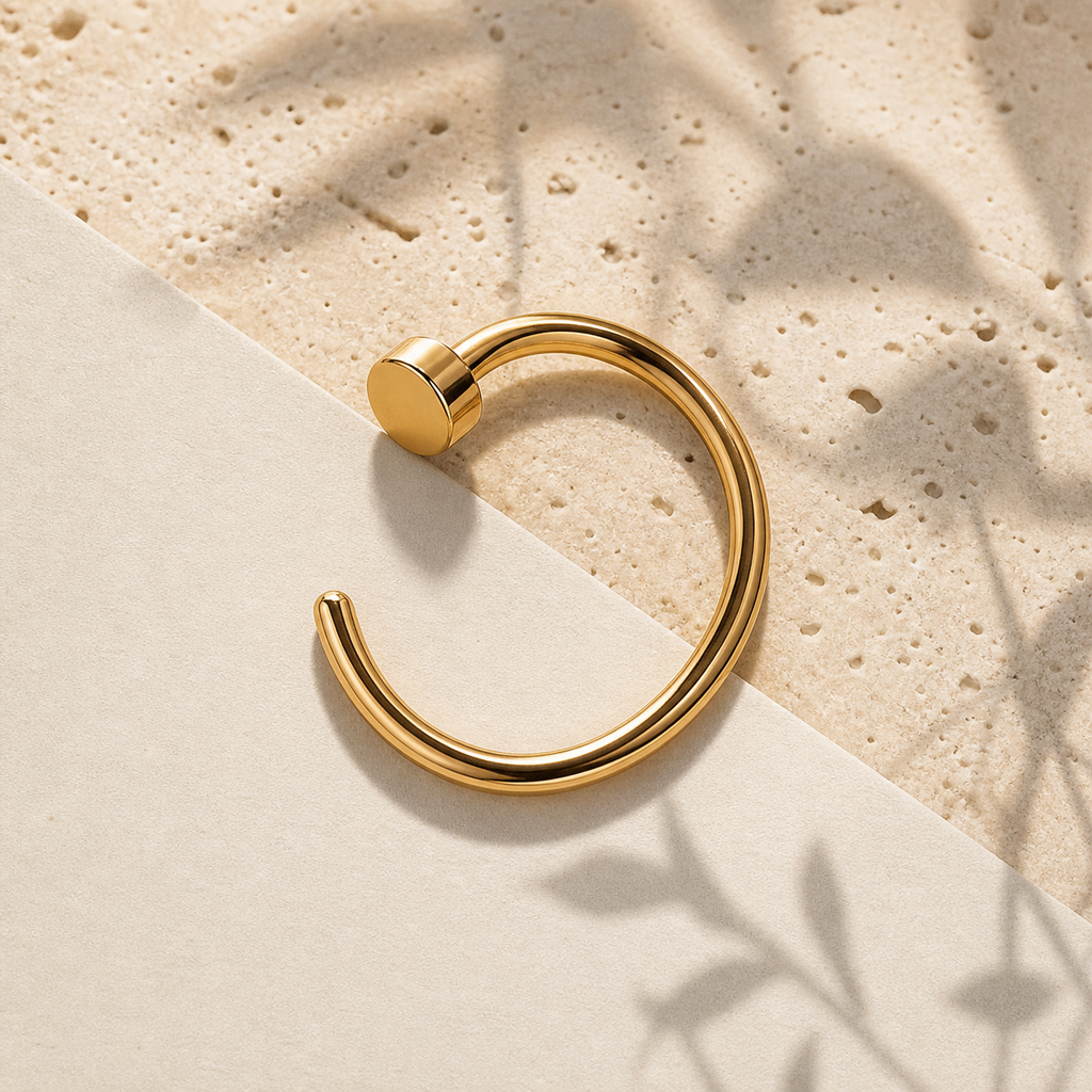 [TOPOSH-ROLE-ORDER-CLEANUP-20260717-BATCH11:TP-NS-GD-18G8-PLN-056:06] Titanium Nose Hoop – Gold | 06_accessory_flatlay
