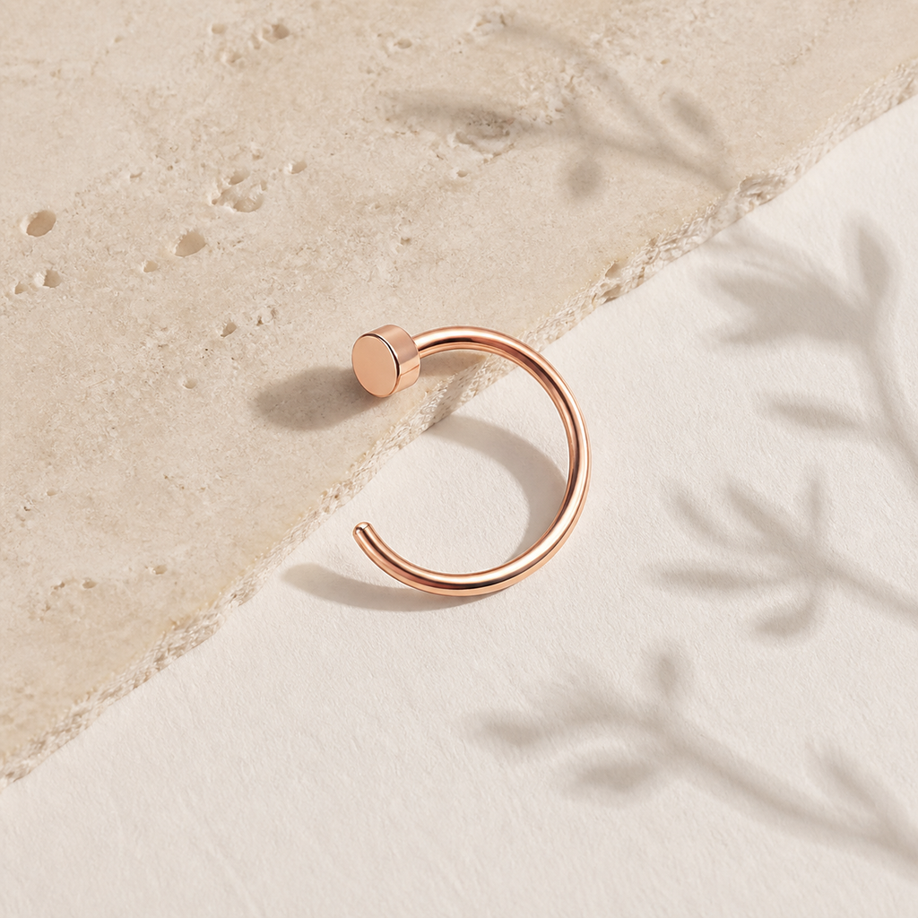 [TOPOSH-ROLE-ORDER-CLEANUP-20260717-BATCH11:TP-NS-RG-18G8-PLN-008:06] Titanium Nose Hoop – Rose Gold | 06_accessory_flatlay