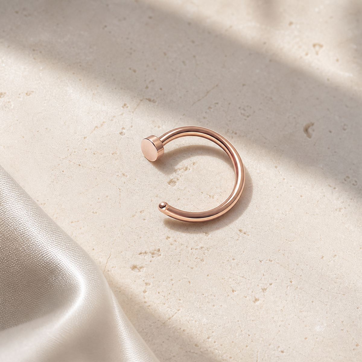 [TOPOSH-ROLE-ORDER-CLEANUP-20260717-BATCH12:TP-NS-RG-18G8-PLN-662:06] Titanium Nose Hoop – Rose Gold | 06_accessory_flatlay