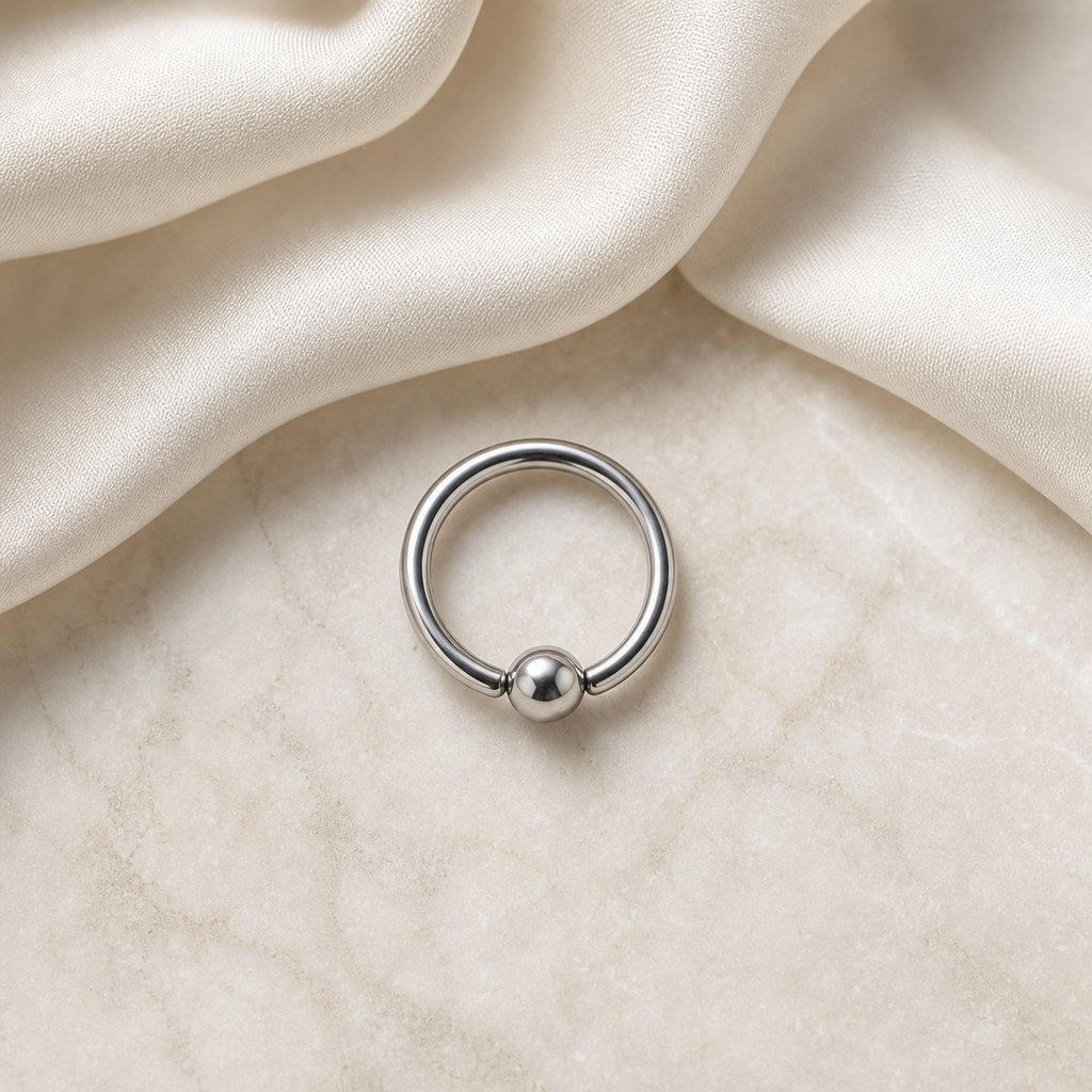 [TOPOSH-LEGACY-LAYOUT-REPAIR-20260717-LEGACY15:TP-BCR-SIL-16G8-PLN-002:06] Titanium Captive Bead Ring – Silver | 06_accessory_flatlay