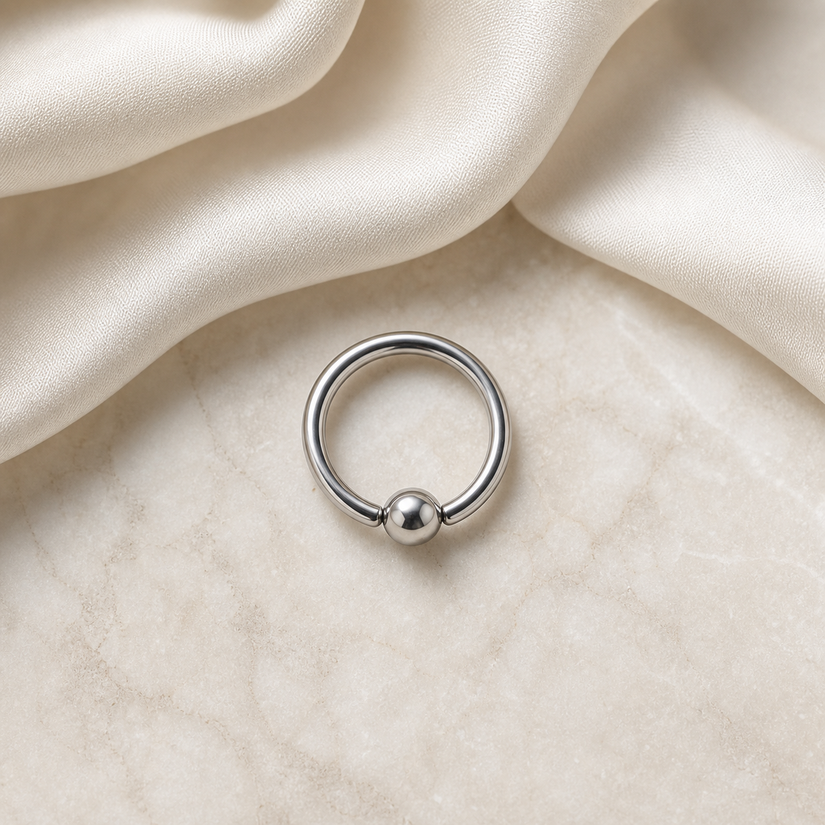 [TOPOSH-LEGACY-LAYOUT-REPAIR-20260717-LEGACY15:TP-BCR-SIL-16G8-PLN-002:06] Titanium Captive Bead Ring – Silver | 06_accessory_flatlay