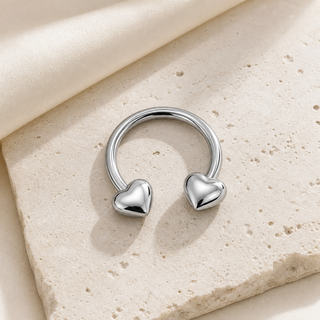 [TOPOSH-LEGACY-LAYOUT-REPAIR-20260717-LEGACY20:TP-HS-EX-SIL-16G10-PLN-005:06] Heart Titanium Horseshoe Ring – Silver | 06_accessory_flatlay