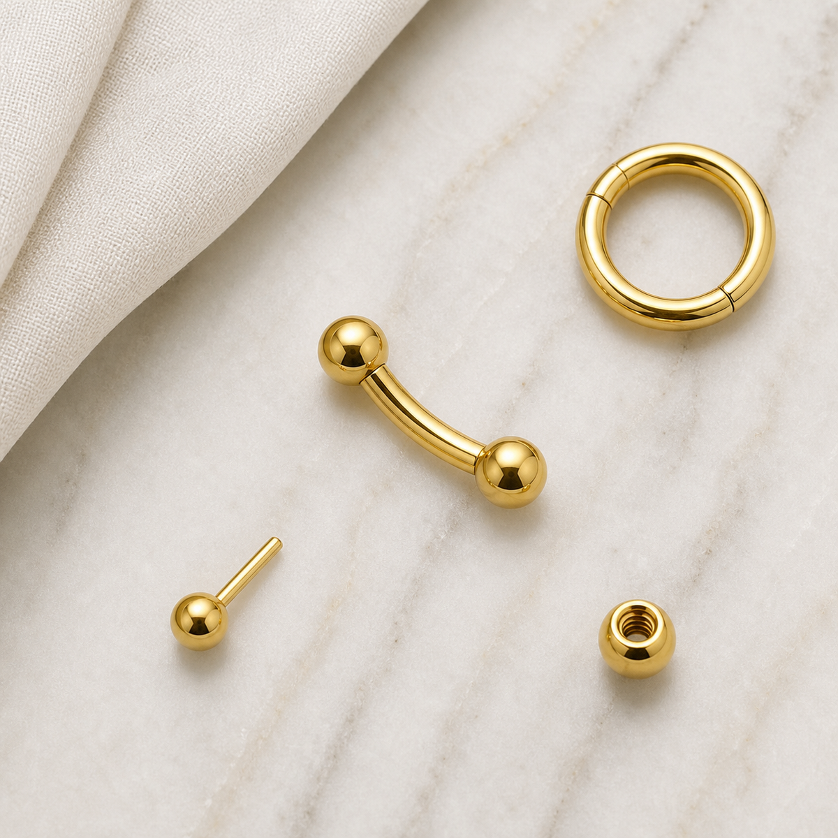 [TOPOSH-ROLE-ORDER-CLEANUP-20260717-BATCH16:TP-EBR-EX-GD-16G8-T3*3-PLN-416:06] Titanium Eyebrow Barbell – Gold | 06_accessory_flatlay