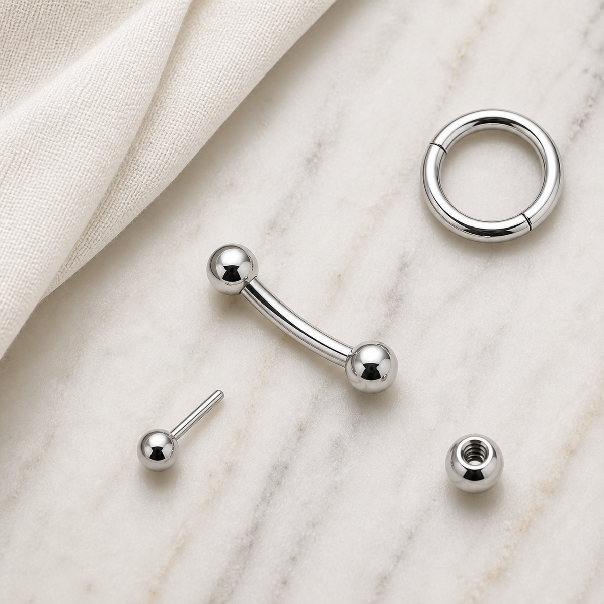 [TOPOSH-ROLE-ORDER-CLEANUP-20260717-BATCH16:TP-EBR-IN-SIL-16G8-PLN-022:06] Titanium Eyebrow Barbell – Silver | 06_accessory_flatlay