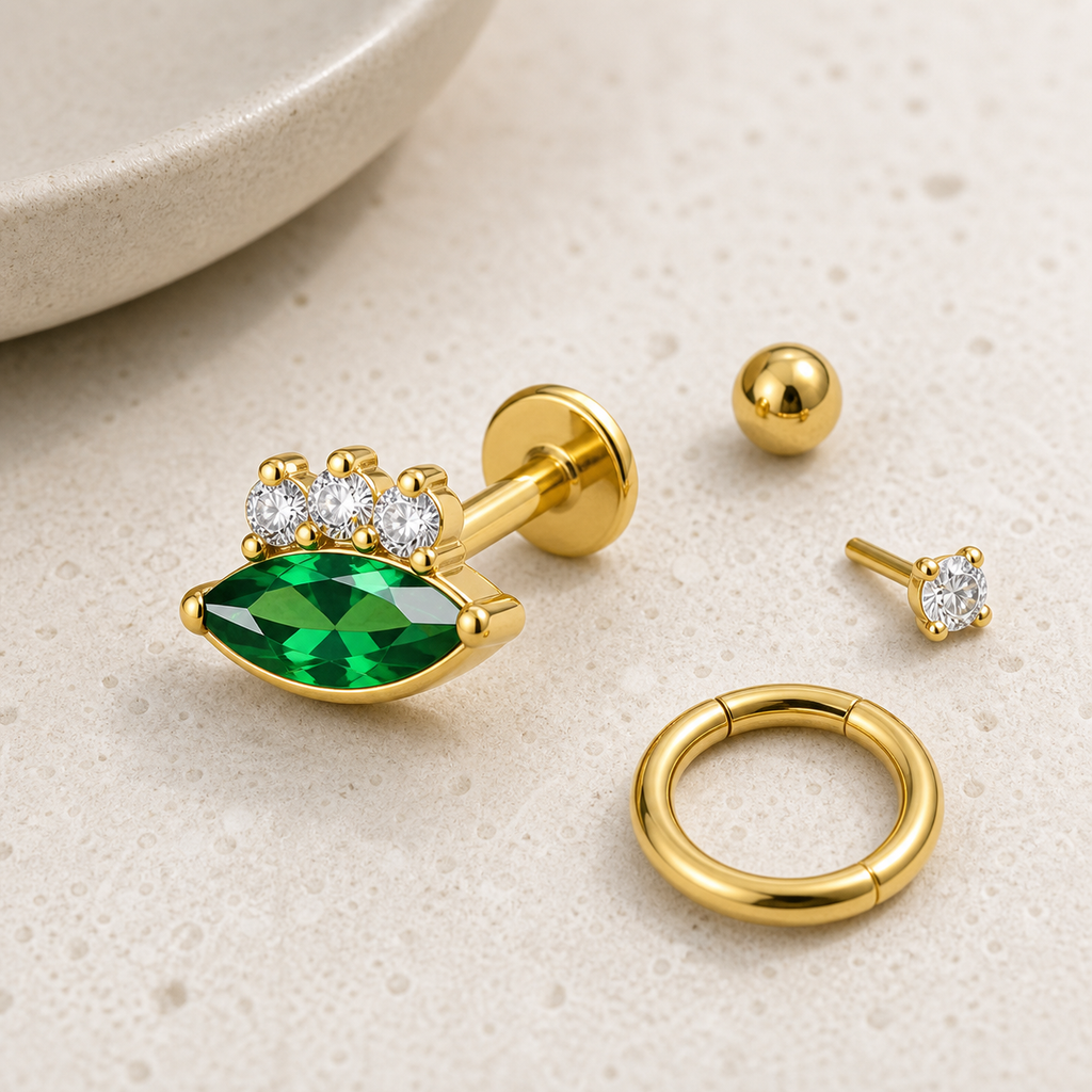 [TOPOSH-LEGACY-LAYOUT-REPAIR-20260717-LEGACY08:TP-FB-IN-GD-16G8-T4-EMD-449:06] Marquise Emerald CZ Titanium Flat Back – Gold | 06_accessory_flatlay