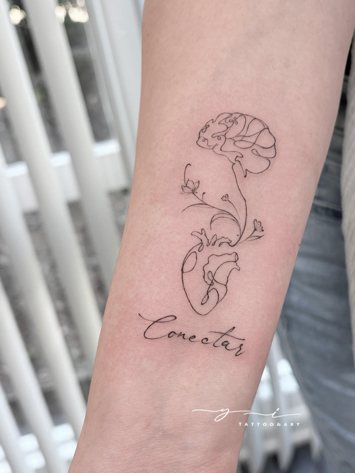 Minimal linework tattoo by Urban Ink artist YI