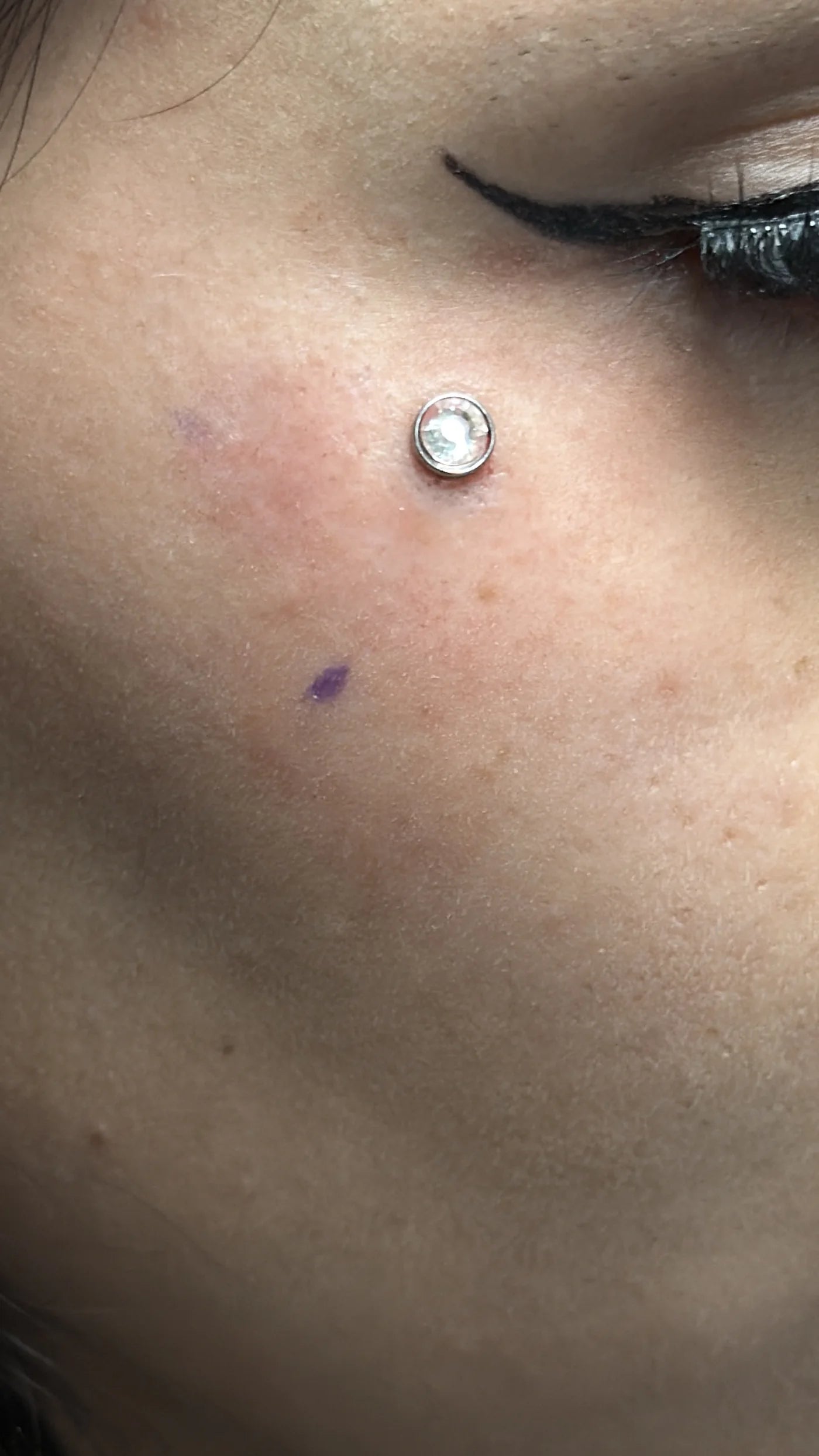 Michael single stone cheek piercing work