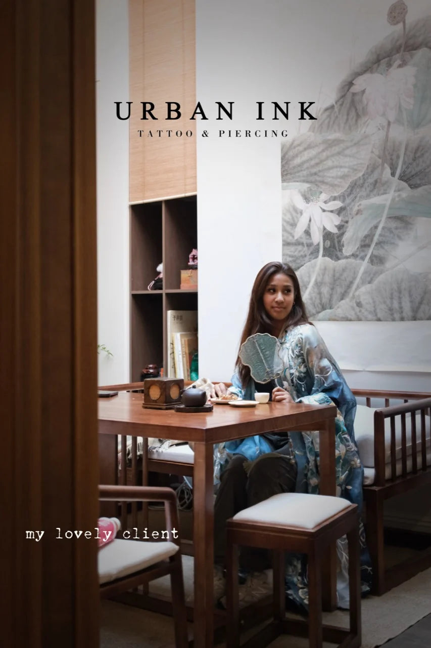 A guest seated in the Urban Ink consultation room