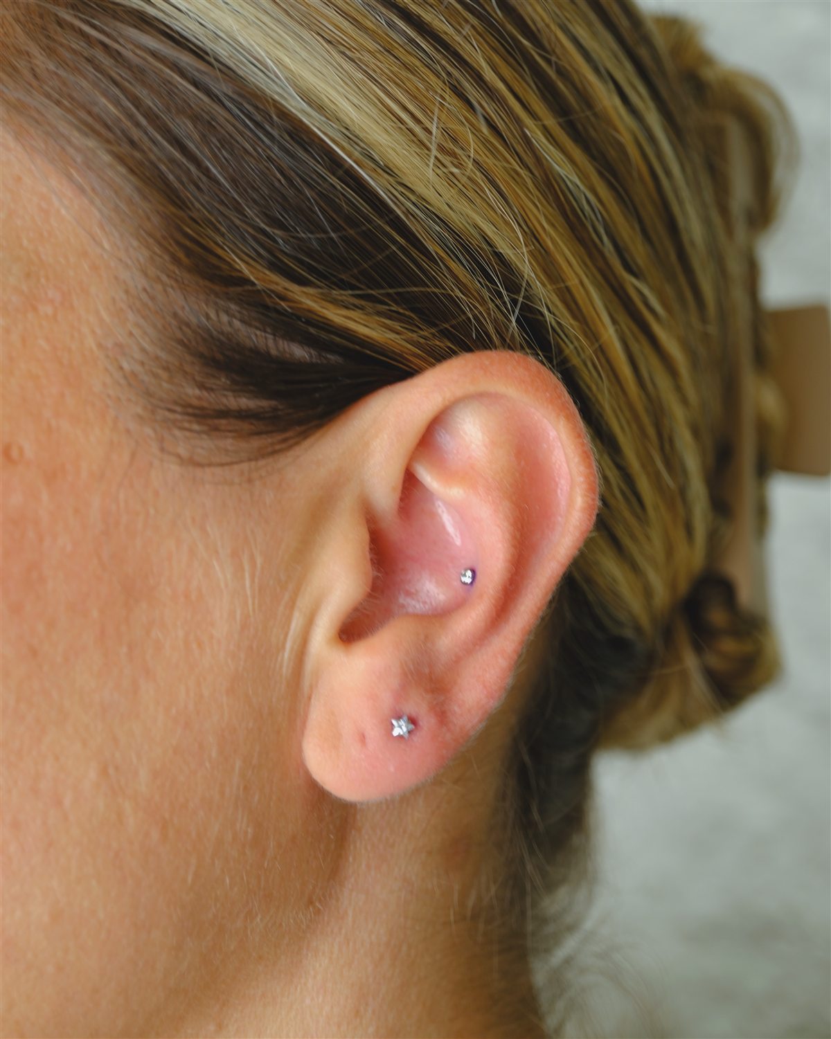 Delicate curated ear piercing completed at Urban Ink
